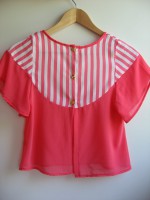 Camisa naranja con botones en el pecho 23,99€